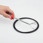 Bendable drain claw tool clearing a clogged shower drain without chemicals
